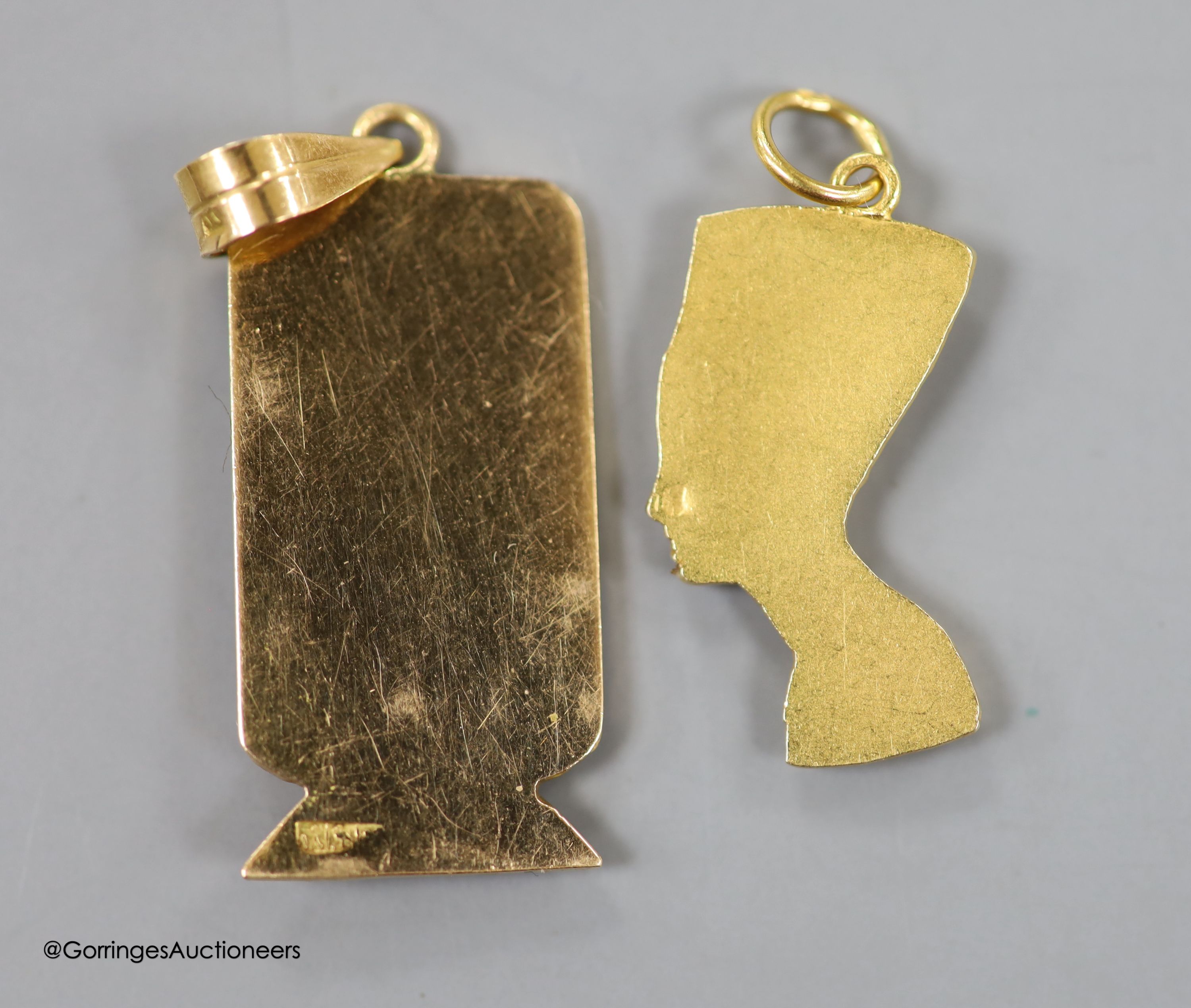 Two Egyptian gold charms (tested as 18ct), gross 6.3 grams.